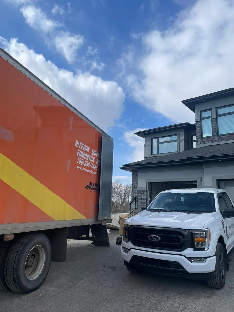 Riteway moving truck outside a family home.