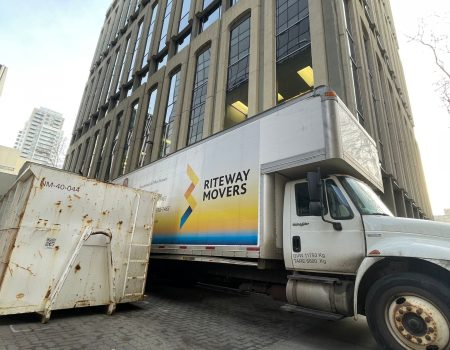 Riteway moving truck beside a downtown office building