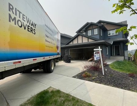 Riteway Movers truck parked outside a Calgary home