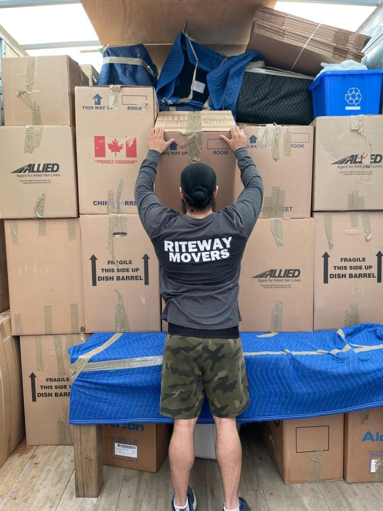 Riteway mover loading a box into the moving truck