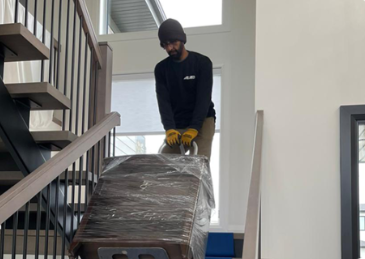 Riteway mover carefully handling furniture inside a home